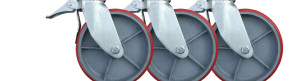 A row of 3 identicle 12 inch casters with brakes